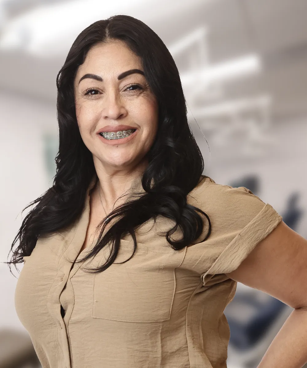 A portrait of Katya C., smiling, showcasing her satisfaction with Vartanian Dental Group’s services.