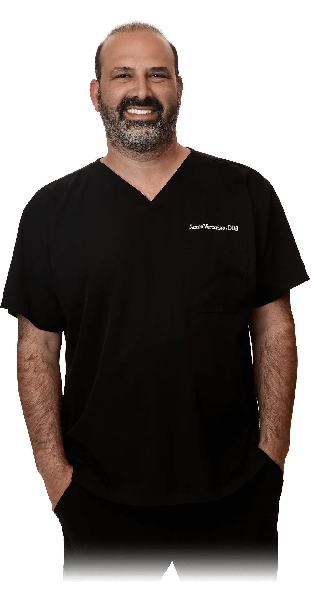 Dr. James Vartanian, DDS, stands confidently in a black dental uniform, showcasing his professional demeanor and readiness to perform dental procedures, including tooth extractions.