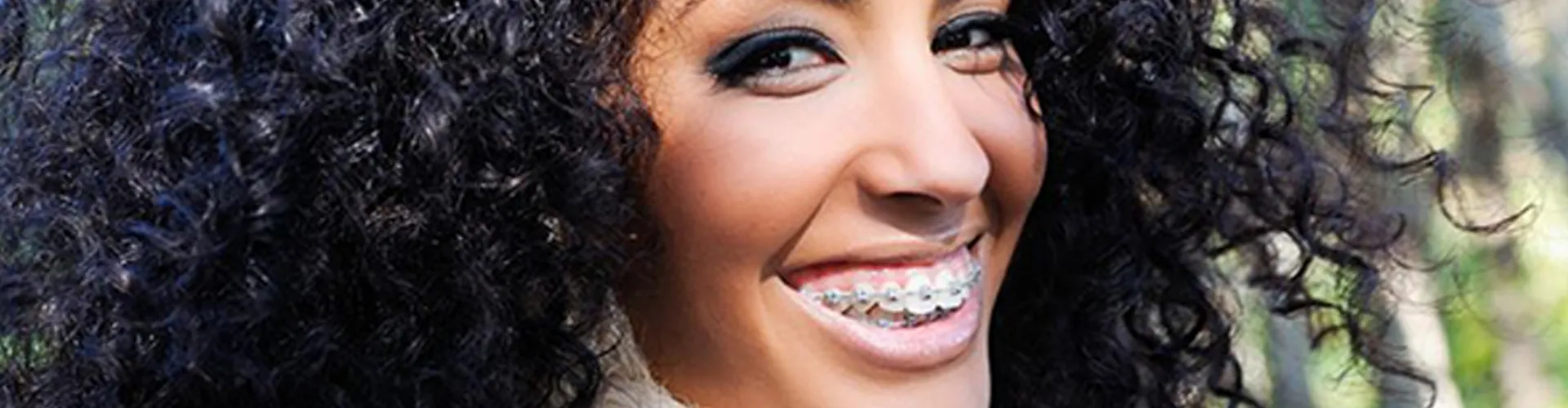 Women with braces smiling