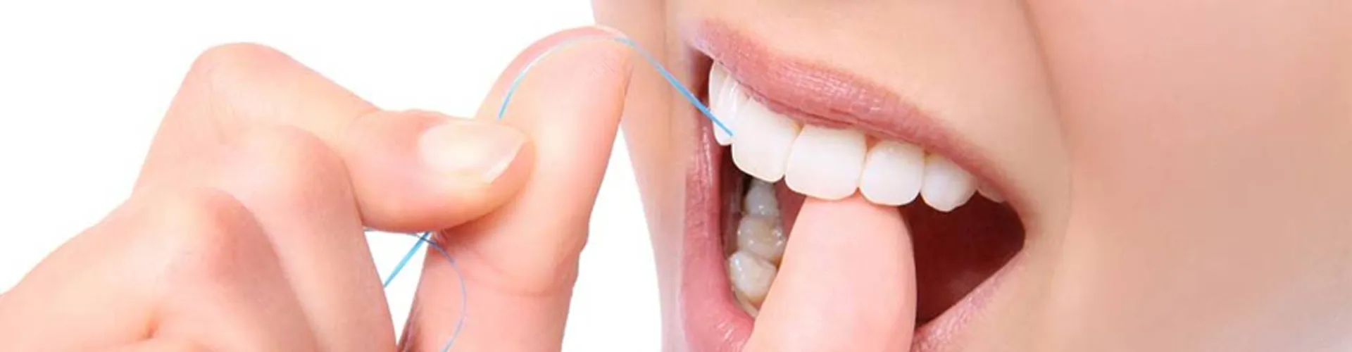 Woman using dental floss